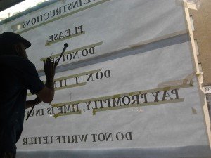 Dishoom sign writing process NGS London sign writing near us. Aphroditi interiors.