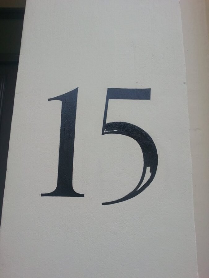 London signwriters Seraina & NGS | NGS Sign lettering & writing. | NGS Sign lettering & writing. Black number 15 painted by hand