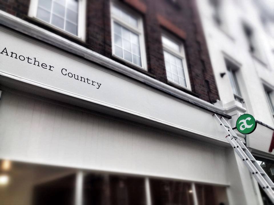 Another Country finished sign written in Typewriter bold London NGS