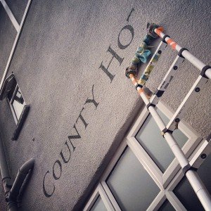 The County Hotel with border High level signage MEWP Harness access specialists