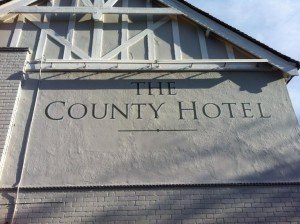 The County Hotel with border High level signage MEWP Harness access specialists