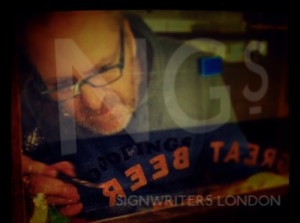 Reverse glass gilding and gold foil/leaf lettering London, by NGS. Gold window signs with matte or mirrored finish. 51.49456765499576, -0.17415278042634838, Chelsea, Fulham road Signwriter, 51.513286138657314, -0.13605138048658413 painted shop signs Soho 51.52381789141246, -0.0772289866369295, Notting hill, Shoreditch signs,