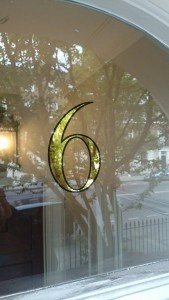 House transom numbers, gold leaf numerals. GLASS GILDING
