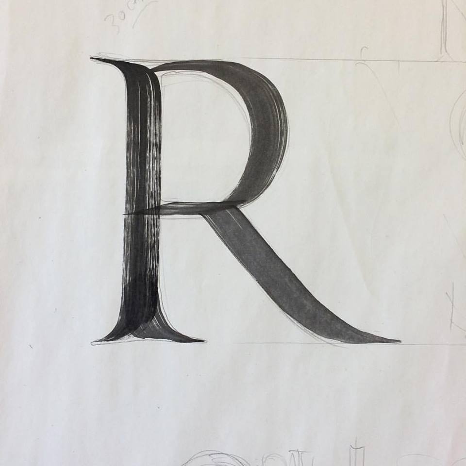 font designer NGS Trajan roman single stroke brushed letter.