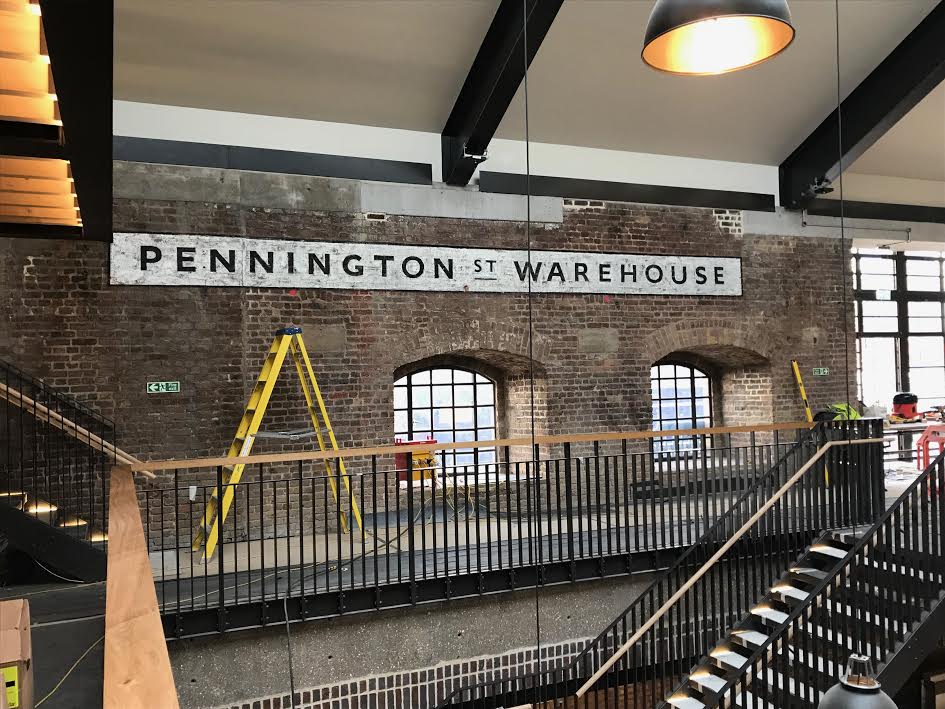JTP Wapping brick wall corp brand ID Wall sign