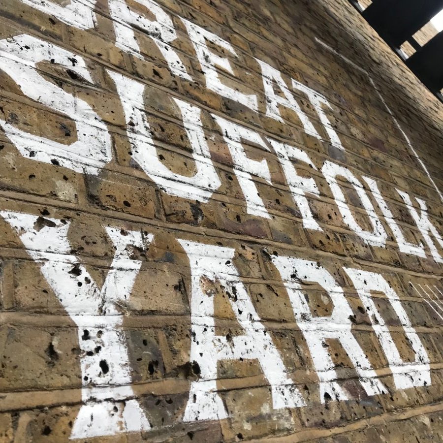 Stencilled letters murals architectural interior walls Nick Garrett sign writer London