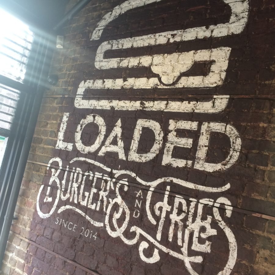 Stencilled letters murals architectural interior walls Nick Garrett sign writer London