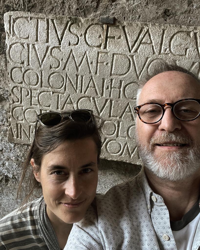 Trajan Letters in Pompeii. Pomp Nick and Seraina lettering |  NGS Font Creators, Sign Designer and the world's finest Sign Writers.
At NGS the creative flexibility of our custom typographical work has become an absolute, catapulting us into new opportunities as trend leading Lettering Artists, From the mid-eighties onwards, typographic design embraced digital tools in earnest, moving on with a big step again technologically and losing in the factory floor culture, the raw smell of ink, clatter of cast iron and steel, and acquired the senses bereft of manual, blue collar contact with the birth of DTP - Desk-Top-Publishing.

Transformers of Classical Type and and Modern era Tags

Today we have today an industry standard creative sign design studio that projects a talent and capability to design for corporates and retail legends. Our new-school approaches compliment our Heritage London reverse glass gilding reputation. We now include full font creation lab aiding our powerful graphic design work, sitting alongside everything we do that drips with paint.

NGS Font development 
Font designer NGS Illustrations, Murals Sign writing Gilding, #footnote#handmadeletters

NGS Fonts

Origins of Type and Tags

As with modern social media, Pompeian graffiti of c75AD, were also subject to phases and trends.

Gladiators and ships belonged to the favourite motifs for sketches, and writing names in the shape of a ship soon caught on as well.

The same lines from popular literature were written on the walls over and over again, and greetings mostly repeat the same, fixed phrase that we also find in Roman letters. 

When a certain Aemilius began to write his name backwards, two other men, Curvius and Sabinus, took up the practice as well, until all three of them were messaging each other in this manner on the walls of one particular house. 

The word “Menedemerumenos”, whose meaning we do not know, also came into fashion at some point and spread all over town, perhaps as a kind of riddle or game.

NGS Font development