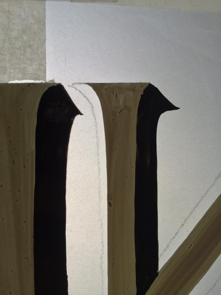 London's roman white gold letters on fanlight glass