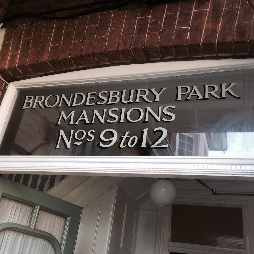 London's roman white gold letters on fanlight glass. Richard Apps sign painters London NGS. Marylebone, Mayfair, Soho, Borough market cafe coffee house signage NGS Chiswick