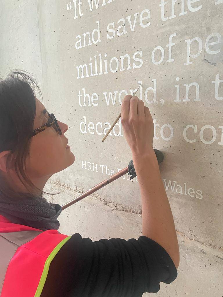 NGS Seraina Painting lettering for Astra Zeneca Cambridge wall Plaque 001