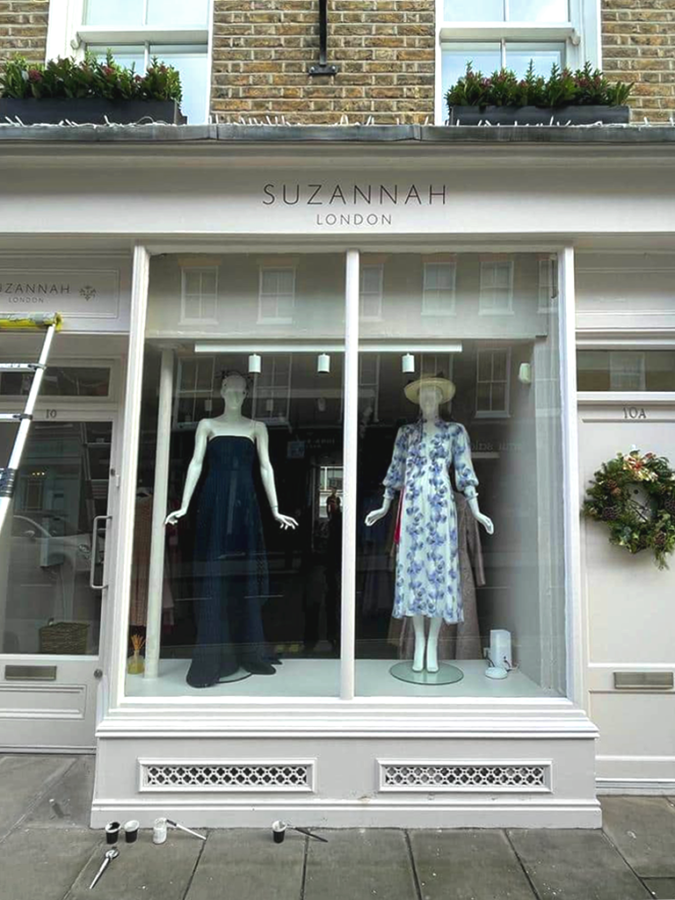 NGS Painted Shop Sign, London fashion store Suzannah, also House numbers names Traditional sign writers of London NGS Dulwich Margate, 51.49456765499576, -0.17415278042634838, Chelsea, Fulham road Signwriter, 51.513286138657314, -0.13605138048658413 painted shop signs Soho 51.52381789141246, -0.0772289866369295, Notting hill, Shoreditch signs, City of London, Hatton Garden, Canary Wharf, Clapham, Seraina, Nick Garrett signage, Wayfinding signs hand painted Balfron T 00b1, Chelsea signwriters, Poplar, St. James's lettering artists, NGS Painted gold House numbers names Traditional sign writers of London NGS Dulwich Margate Chelsea signwriters, NGS Choosing Keeping faux marbling, gold leaf on glass signs, letter gilding NGS signs of London 3 Painted House numbers names Traditional sign writers of London NGS Dulwich Margate Chelsea signwriters