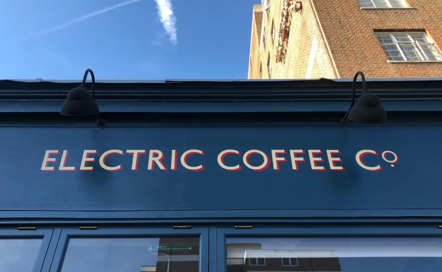 ECC cafe coffee house signage NGS Chiswick, Central, NGS, London Sign painters, NGS stylish sign writers. NGS, Traditional signs of London Official. What do Sign painters do? What Are Sign Writers Called? What does a Sign writer Do? What Paint do Sign Writers Use? Commercial signs, A traditional London sign writer, producing, painted & gold leaf gilt sign writing. Painting or gilding a retail shop front, restaurant or commercial lettering, Murals. London based Traditional sign painter and mural artist Seraina, Technical info, Moda-Hove-custom-sign-writing-by-NGS-bronzed-aged-wall-art-logo-detail