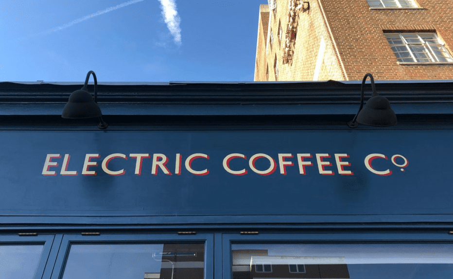 ECC cafe coffee house signage NGS Chiswick, Central, NGS, London Sign painters, NGS stylish sign writers. NGS, Traditional signs of London Official. What do Sign painters do? What Are Sign Writers Called? What does a Sign writer Do? What Paint do Sign Writers Use? Commercial signs, A traditional London sign writer, producing, painted & gold leaf gilt sign writing. Painting or gilding a retail shop front, restaurant or commercial lettering, Murals. London based Traditional sign painter and mural artist Seraina, Technical info, Moda-Hove-custom-sign-writing-by-NGS-bronzed-aged-wall-art-logo-detail