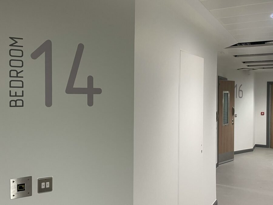 Lift reception lobby - signage Wayfinding Camden Mental Health Lift Lobby wall numbers