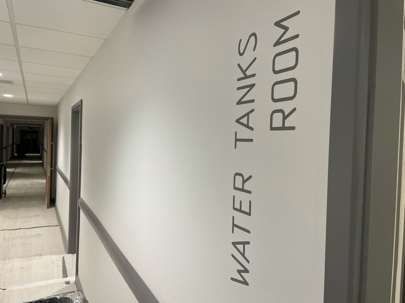 Lift reception lobby - signage Wayfinding Camden Mental Health bedroom/Lift Lobby wall numbers | NGS Sign lettering & writing. Hand Painted Signage Lift reception lobby - signage Wayfinding Camden Mental Health bedroom/Lift Lobby wall numbers