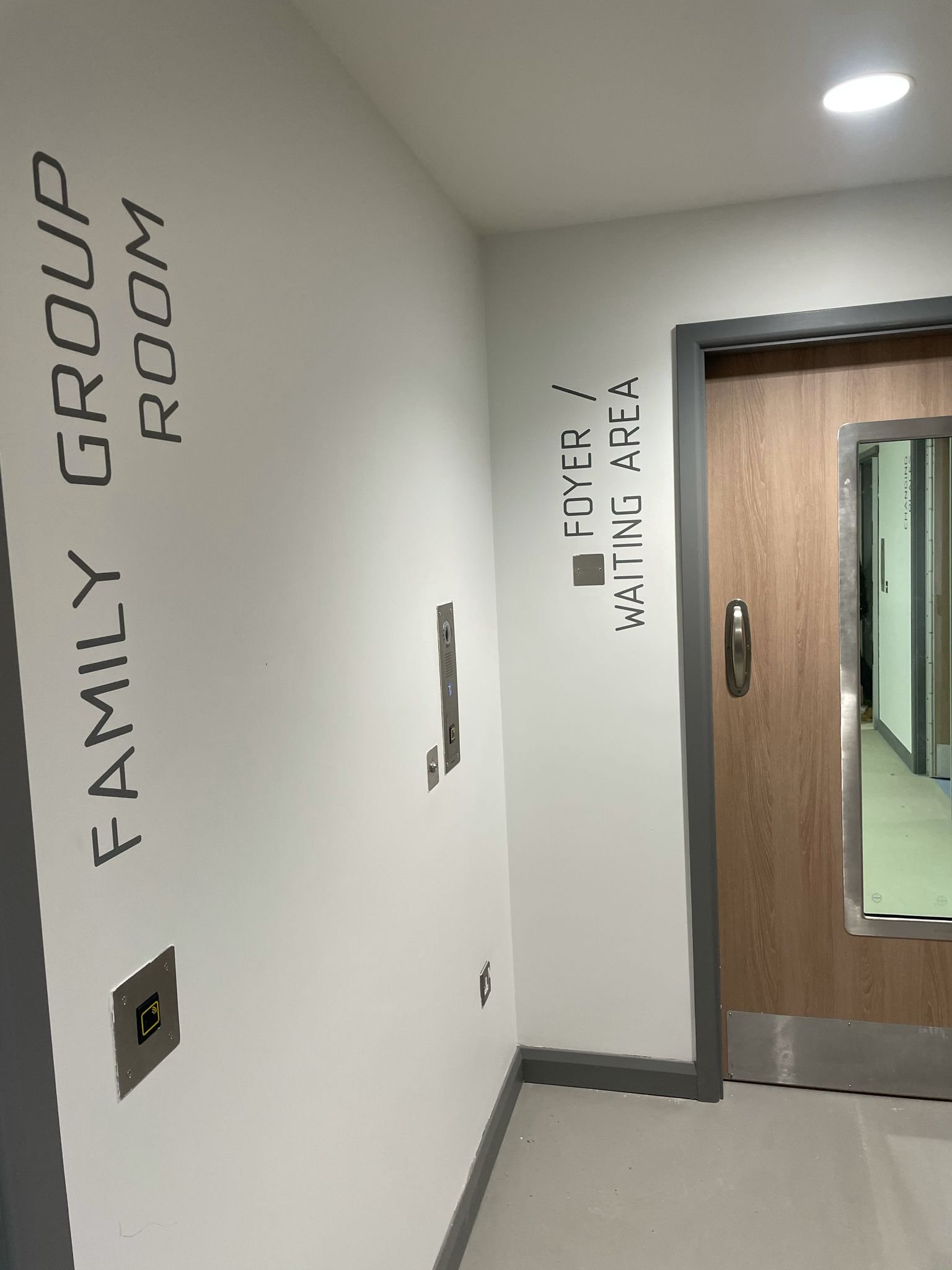 Wayfinding Camden Mental Health Lift Lobby wall numbers | NGS Sign lettering & writing. Wayfinding Camden Mental Health Lift Lobby wall numbers