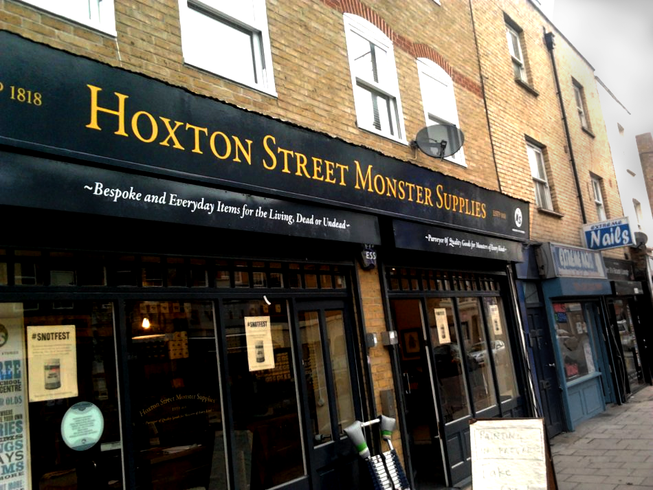 Hoxton Sign Painters NGS , LONDON'S FLAGSHIP GOLD SHOP SIGNS, sign painters NGS near us Seraina and Nick Sign writing duo. NGS sign writing London