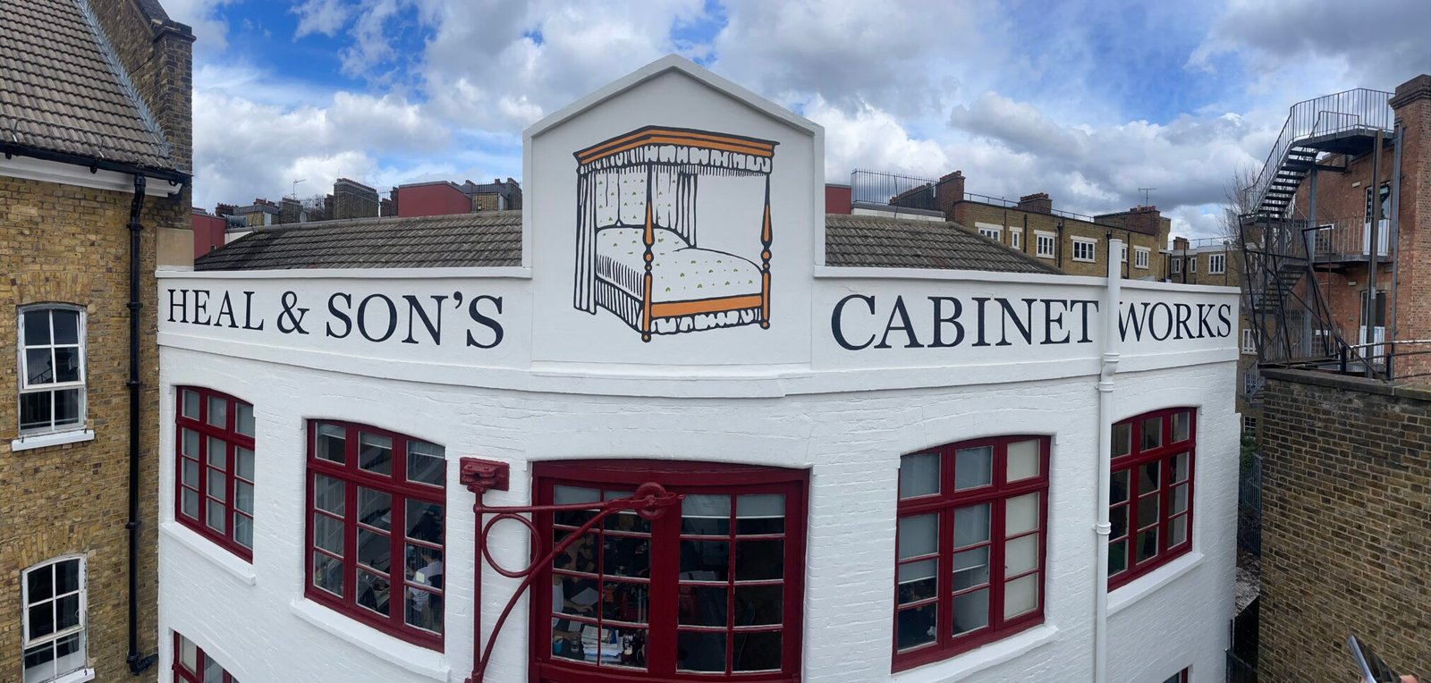 Heal & Son's London high level signage - scissor lift, cradle, mewp high level signage. NGS London