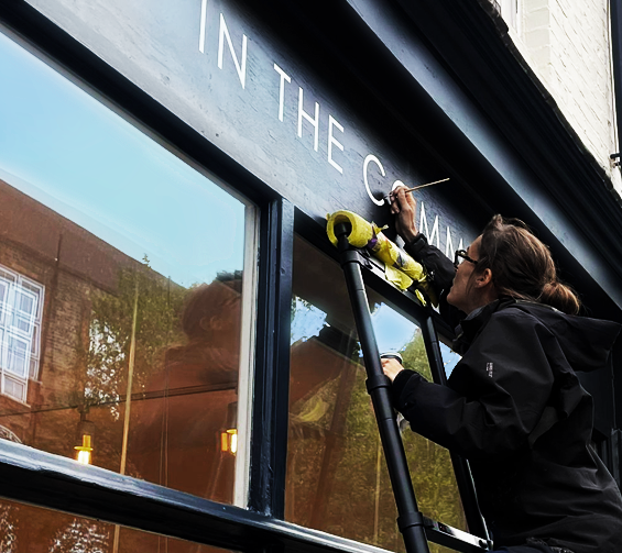 Seraina Sign Writer London The Space shop studio sign writing London . NGS
