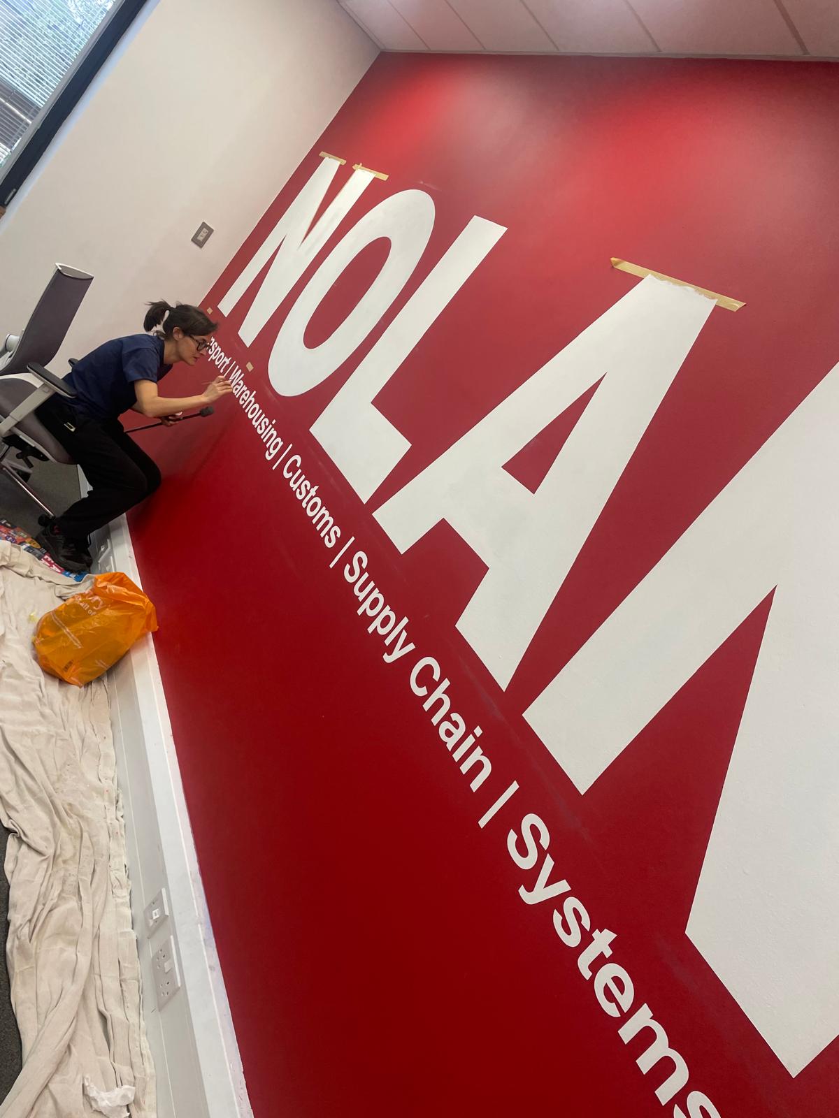 Signwriter Office space Wall graphic painter.