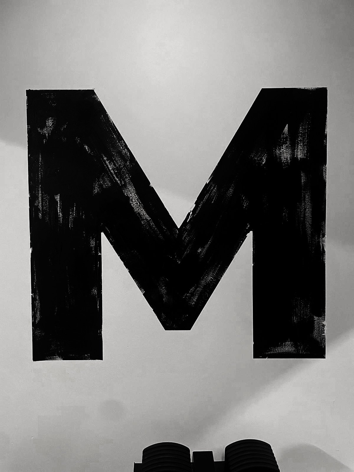 Brand ID painted onto a wall, In Gym, London