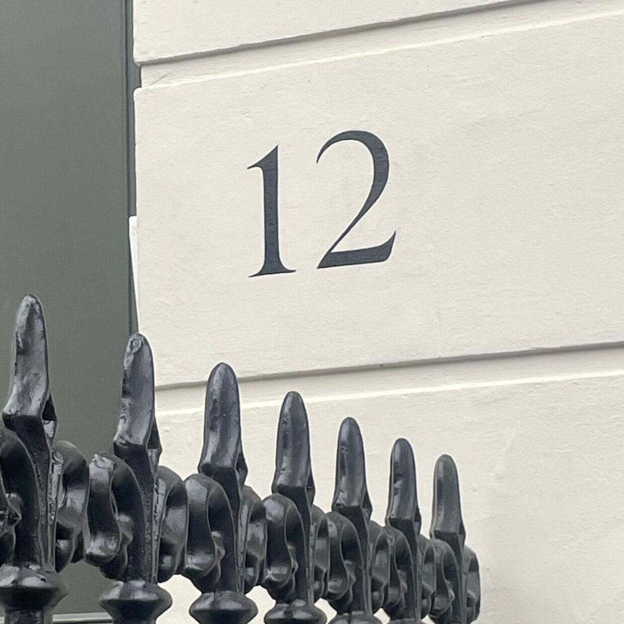 House numbers painted by hand on Pillars