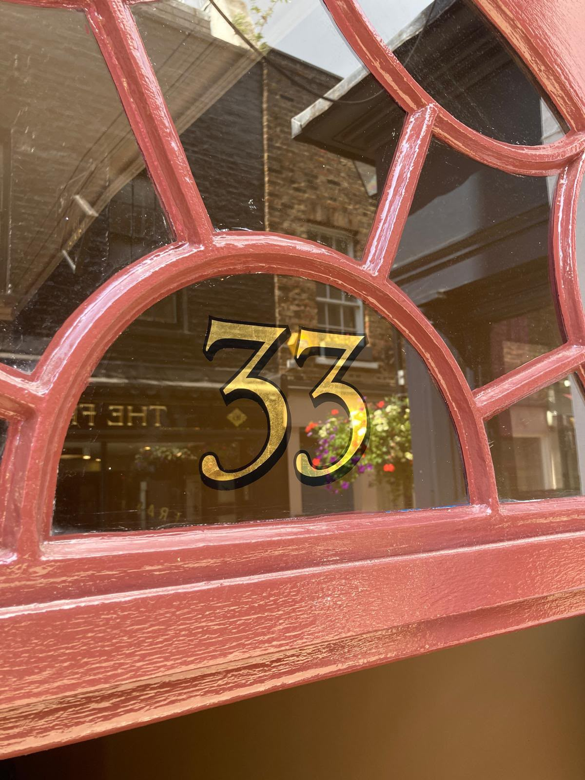 Red arched fanlight window with a decorative gold leaf lettering NGS Signs | NGS Sign lettering & writing. SW1W Restoration of House numbers hand painted sign writer - gold leaf transom, Painter signs by NGS