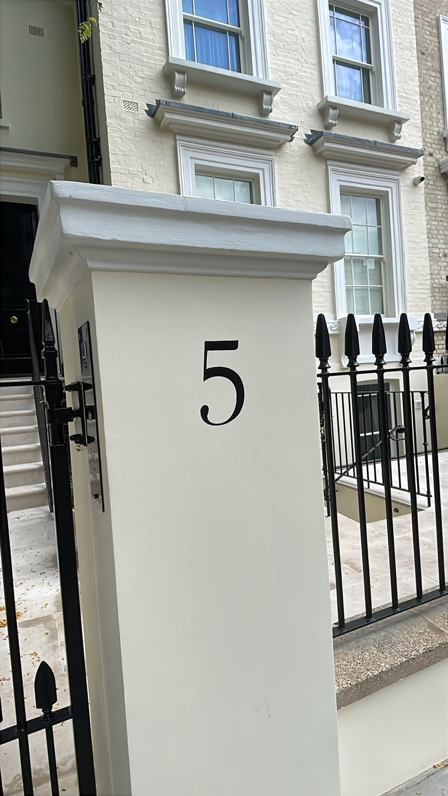 House numbers painted by hand on Pillars NGS London