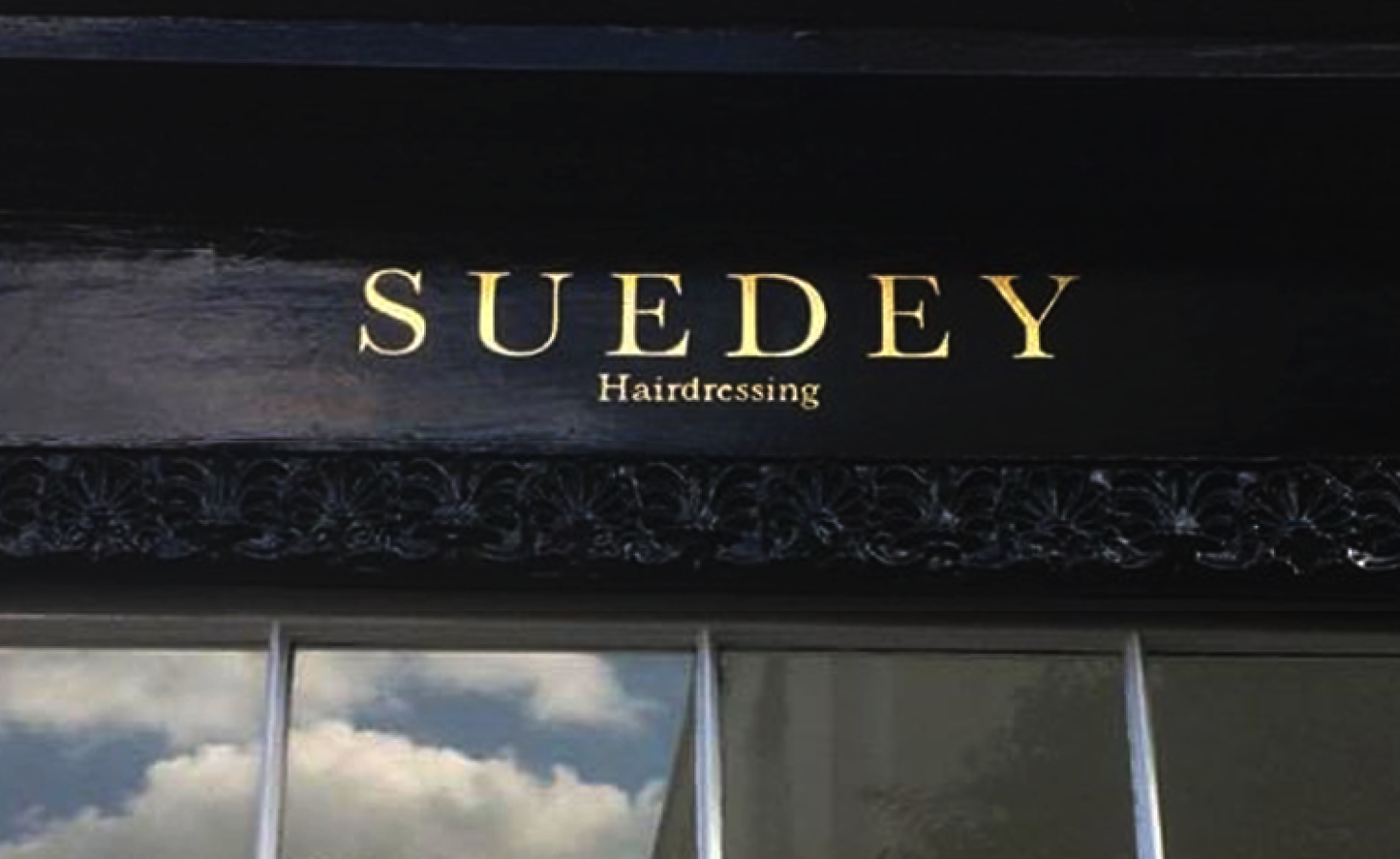 Traditional sign writer, Suedey Gilded Roman lettering to shop London